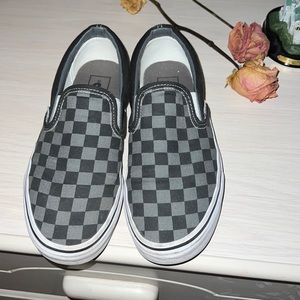 Gray and black checkered vans